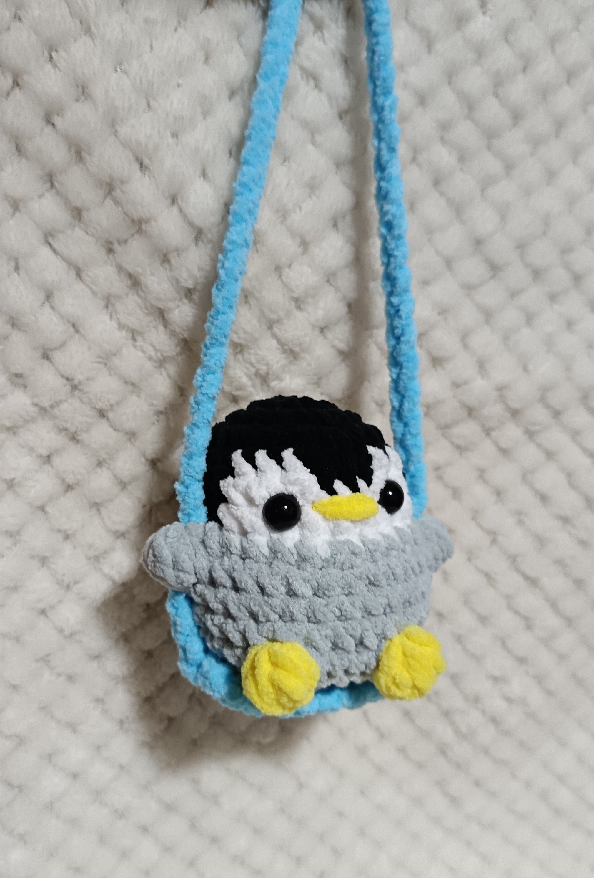 Pingouin sur balançoire